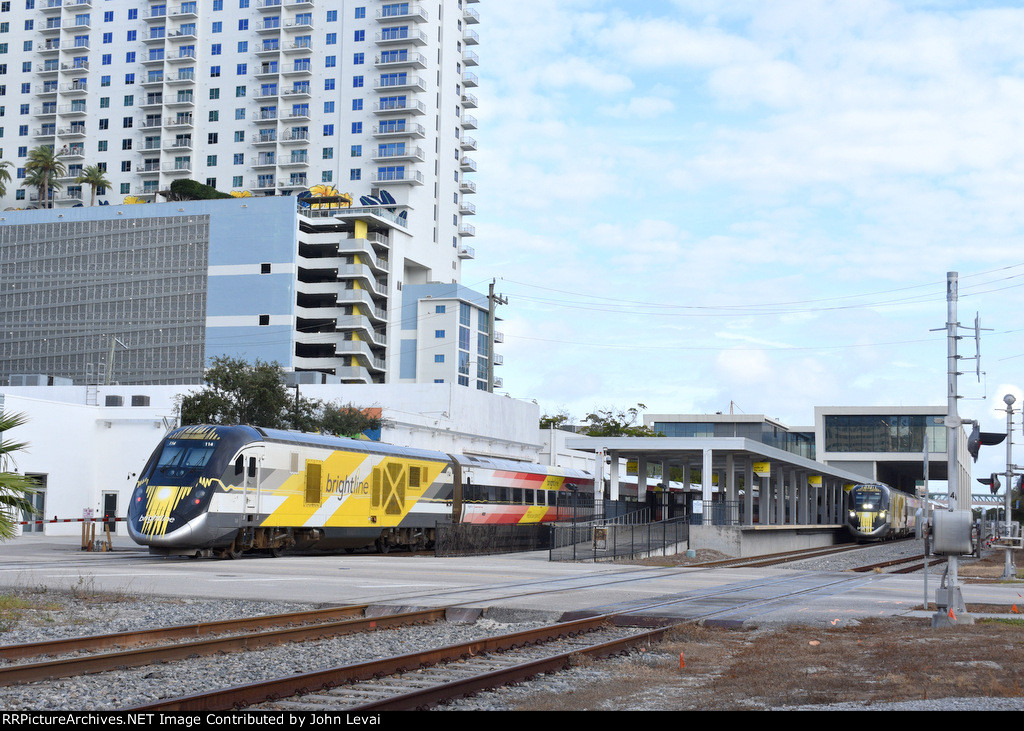 Two Brightline trains meet at the WPB Brightline station in beautiful Downtown WPB